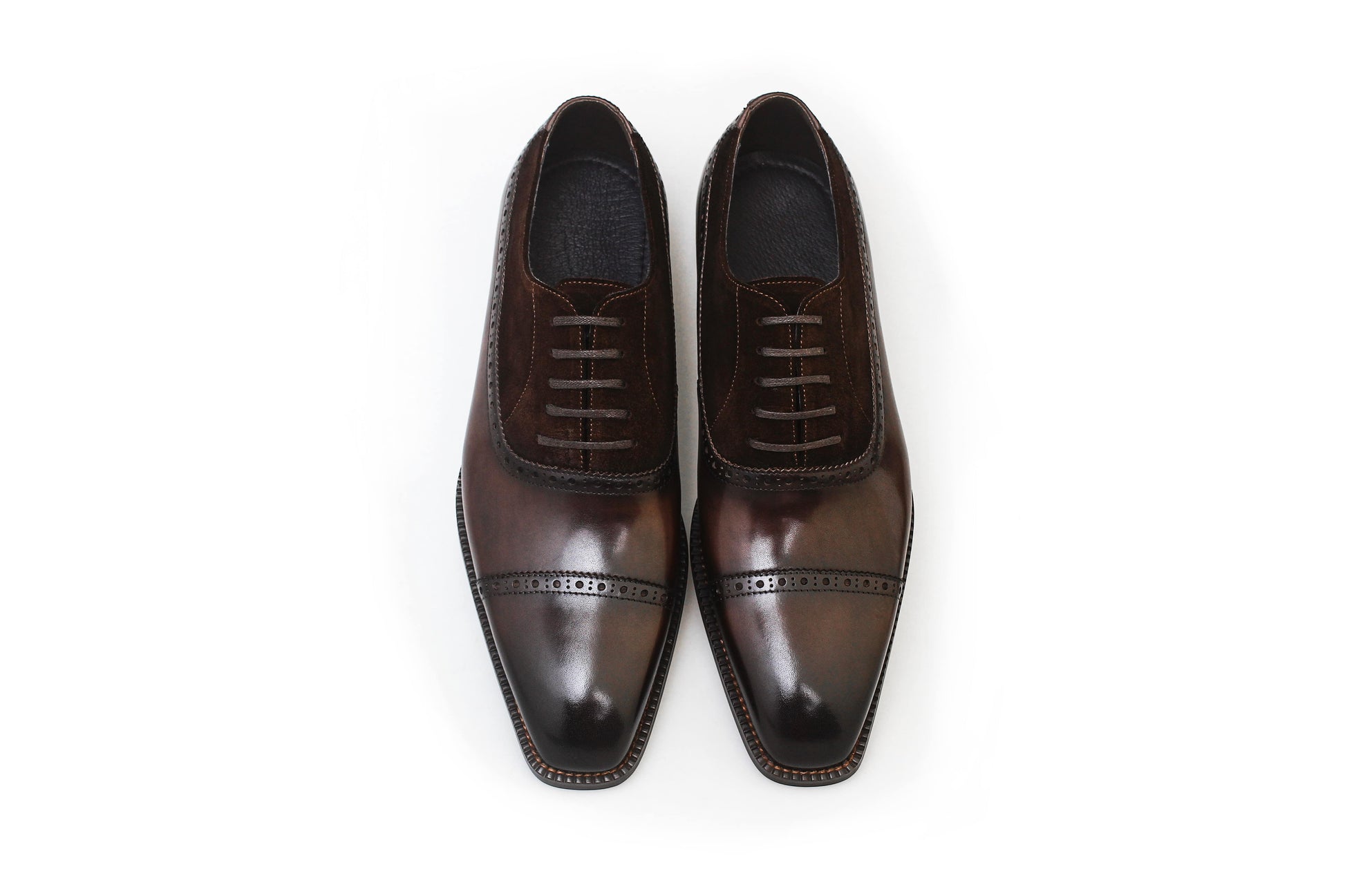 Top view of men's chestnut leather and suede oxford shoes, featuring a two-tone design and cap-toe detailing, perfect for formal occasions and luxury fashion.