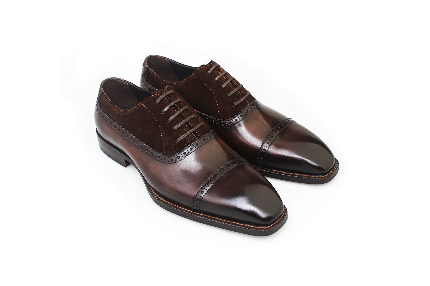 Top view of men's chestnut leather and suede oxford shoes, featuring a two-tone design and cap-toe detailing, perfect for formal occasions and luxury fashion.