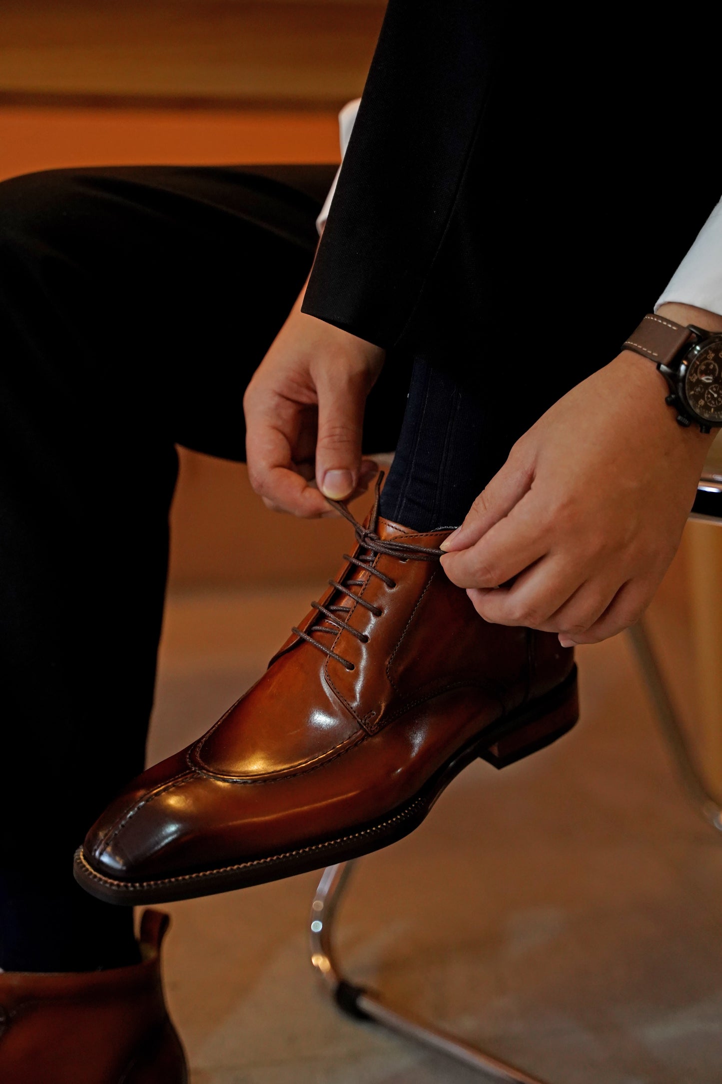A pair of handcrafted Brown Windsor Lace-Up Boots, made from polished leather, showcasing a sleek and elegant design ideal for formal and casual wear.