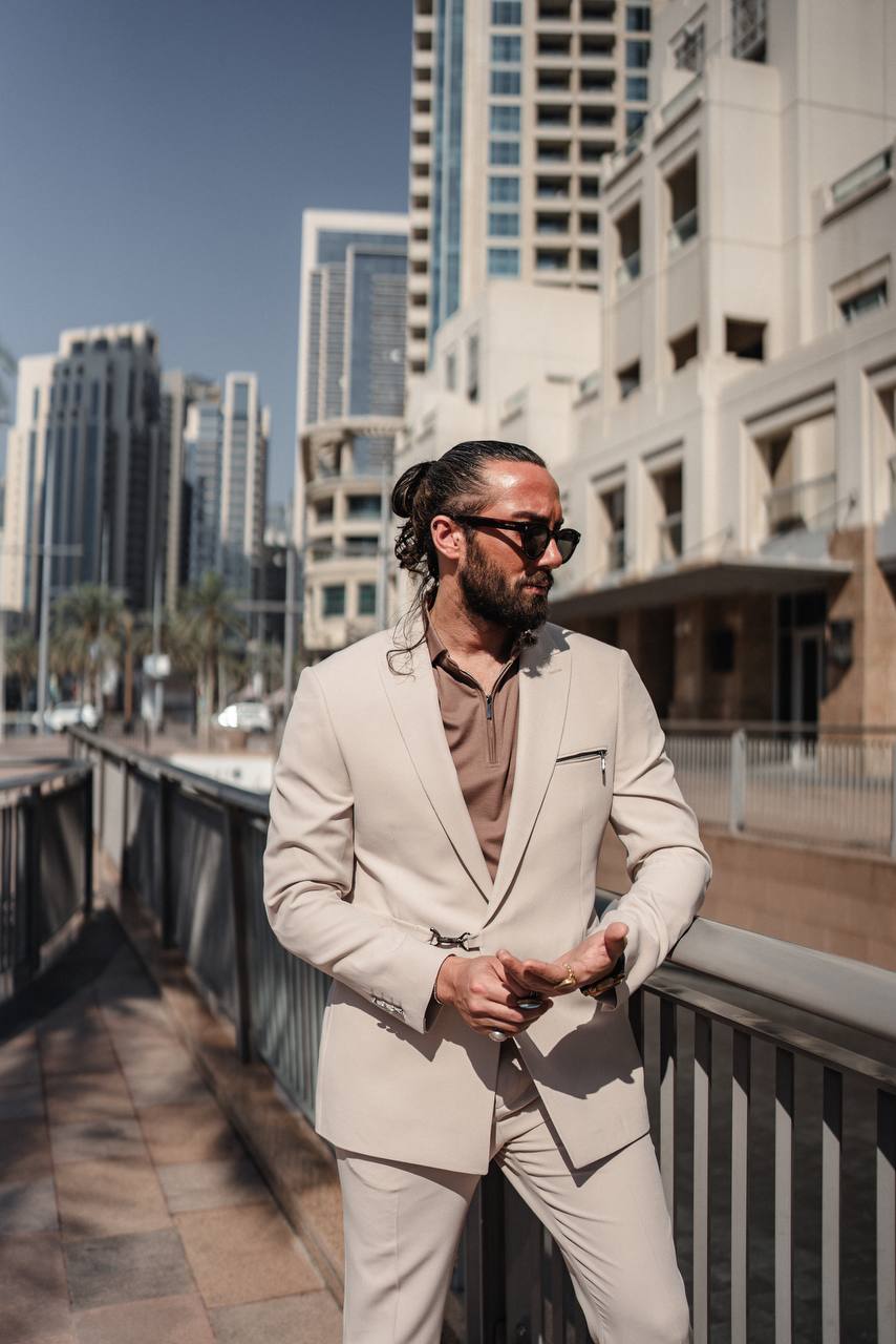 Close-up of beige suit fabric and zipper details in lifestyle shot