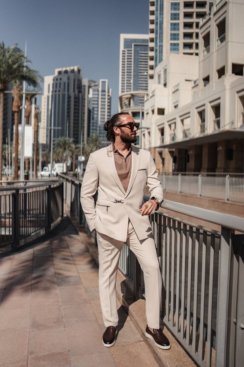 Men’s beige slim fit tailored suit with modern zip details, city background
