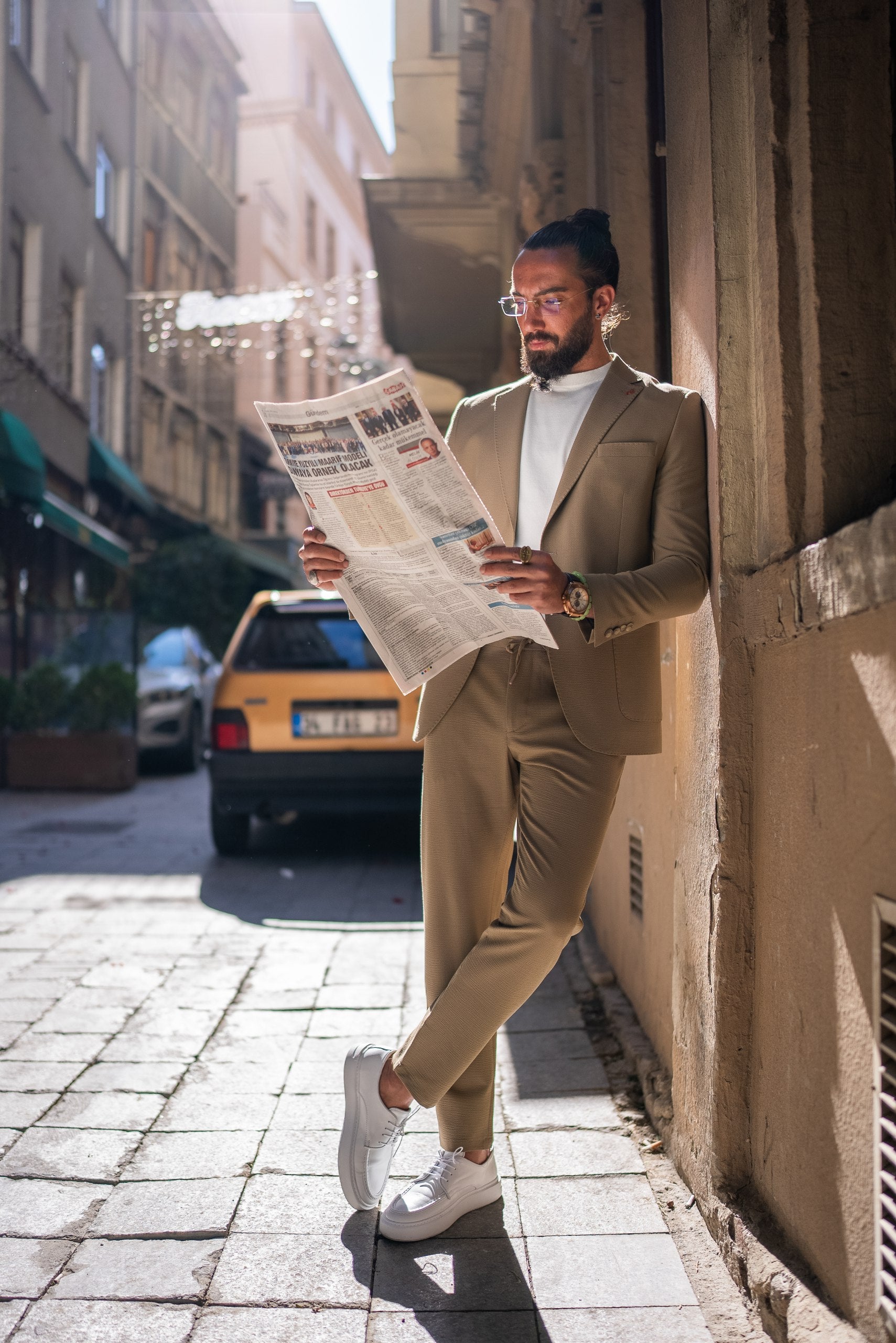 Camel summer suit for men paired with white T-shirt and sneakers, styled for casual outdoor elegance