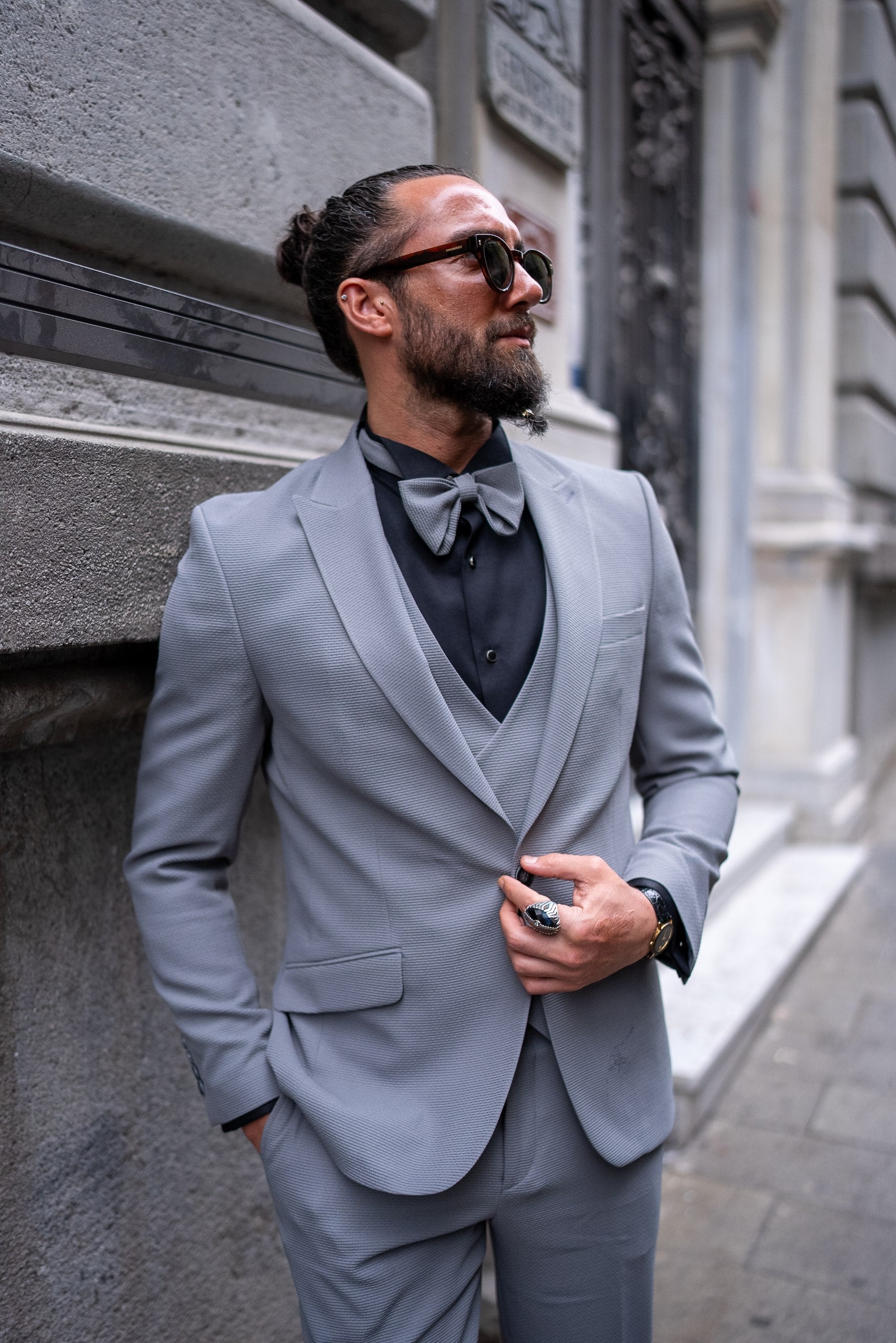 Elegant men’s slim fit gray suit styled for formal events