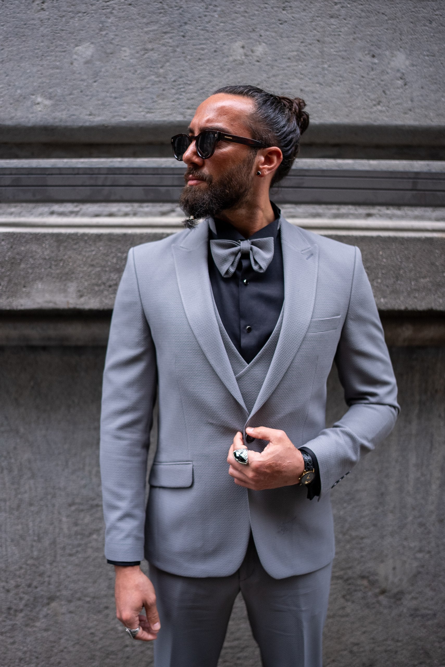 Modern tailored gray groom suit with vest and bow tie
