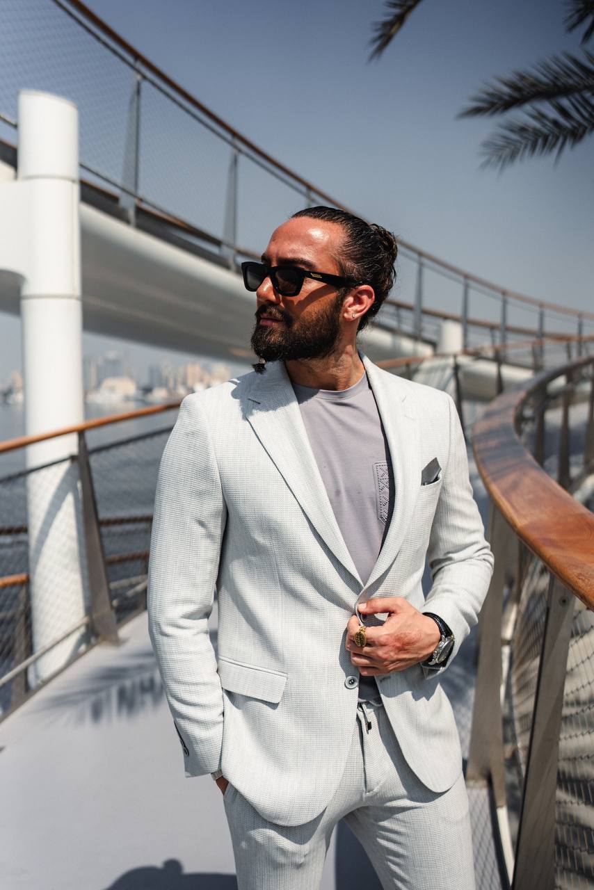 Gray tailored suit with relaxed fit, ideal for business casual occasions
