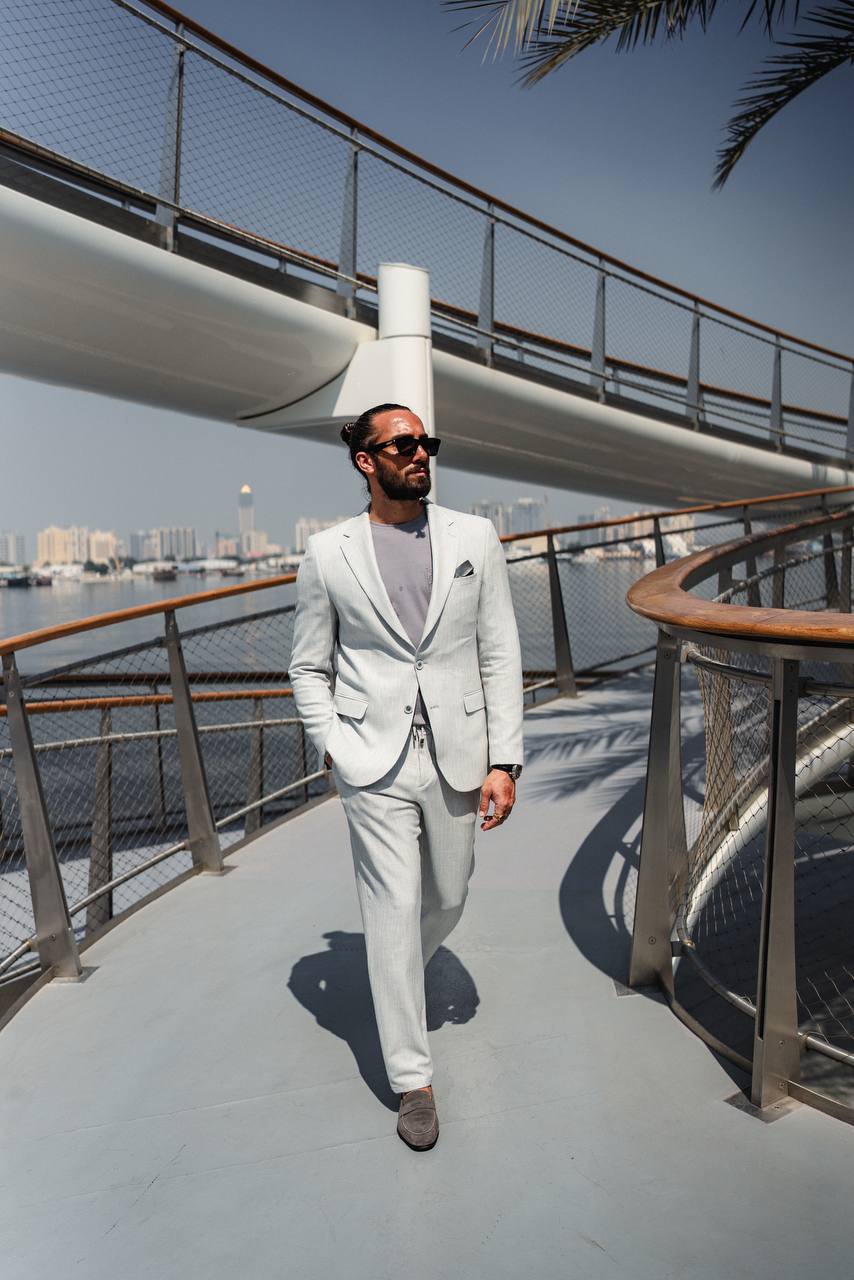 Close-up of gray suit texture and pocket square in lifestyle shot