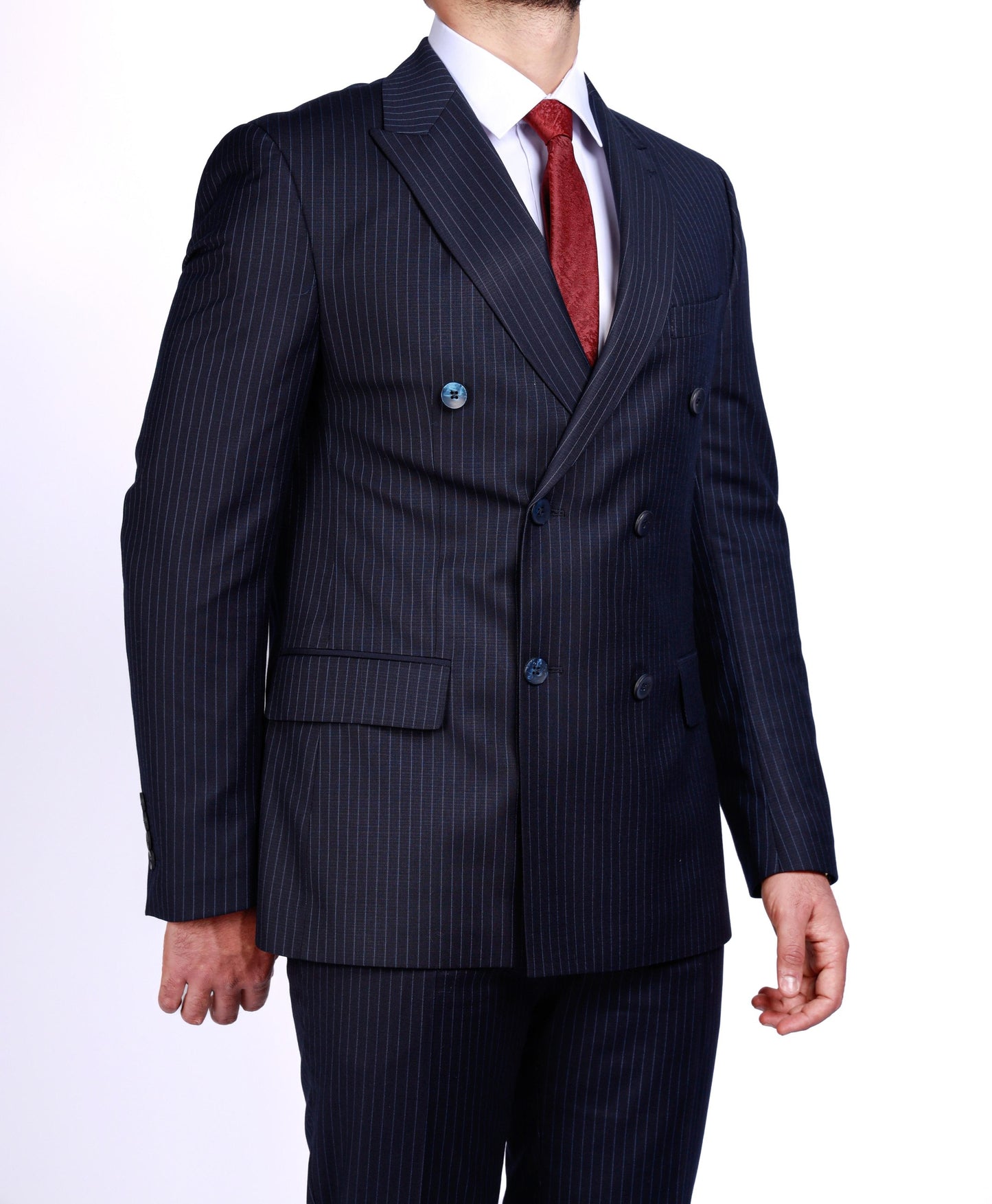 Navy pinstripe suit with a red tie on a white background