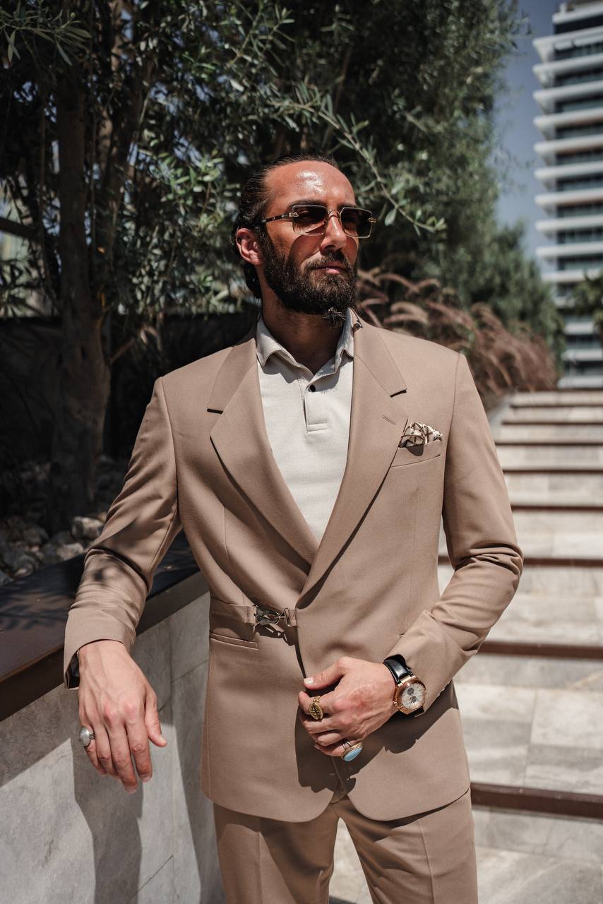 Man wearing SUITHARBOR™ Vizon Tailored Suit by the water with city skyline