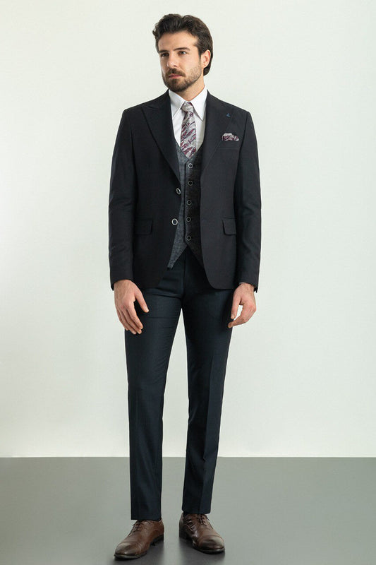 Man wearing a Patterned Dark Gray Suit with a black jacket and gray vest.