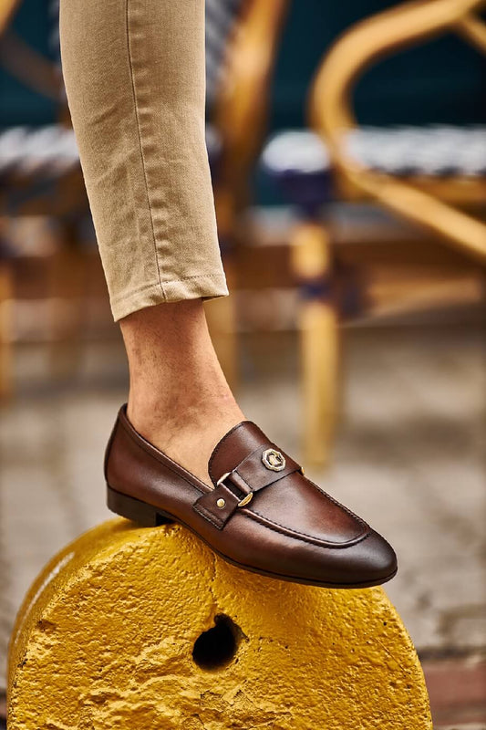 Brown penny loafers with a buckle detail, ideal for groomsmen and fall weddings, showcasing timeless style and comfort.