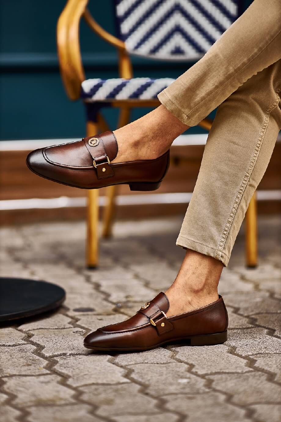 Brown penny loafers with a buckle detail, ideal for groomsmen and fall weddings, showcasing timeless style and comfort.
