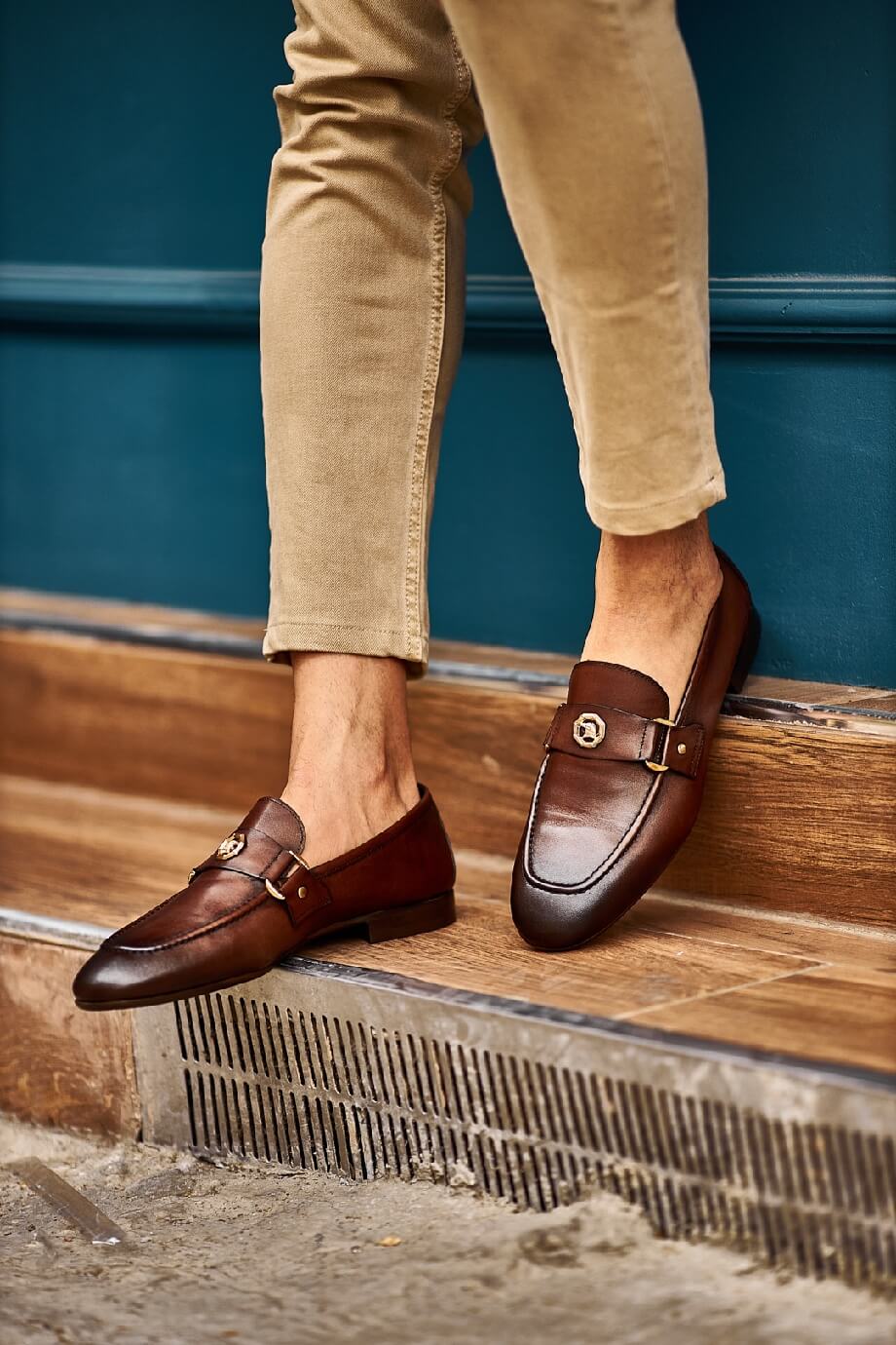 Brown penny loafers with a buckle detail, ideal for groomsmen and fall weddings, showcasing timeless style and comfort.