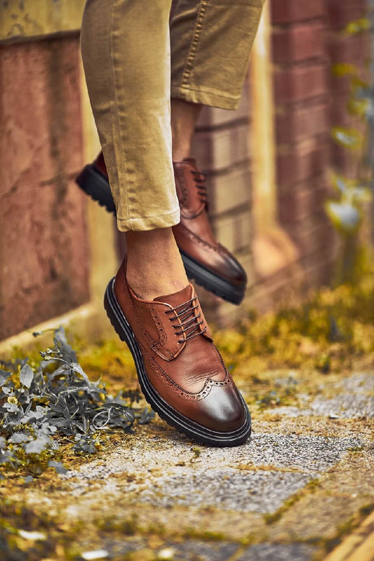 Close-up of Suitharbor Camel Leather Brogues worn with khaki pants, ideal leather dress shoes for weddings and formal events.