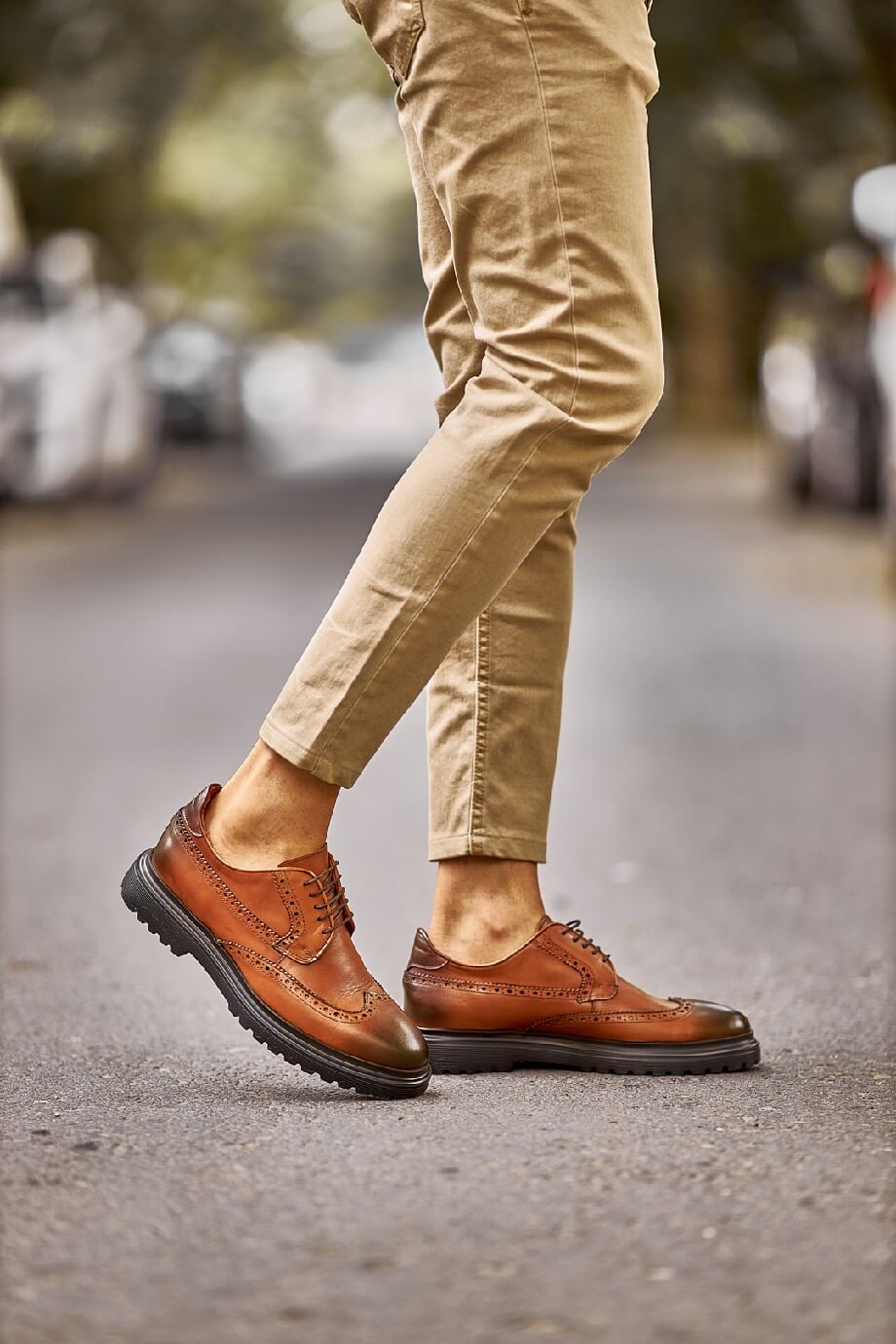 Close-up of Suitharbor Camel Leather Brogues worn with khaki pants, ideal leather dress shoes for weddings and formal events.