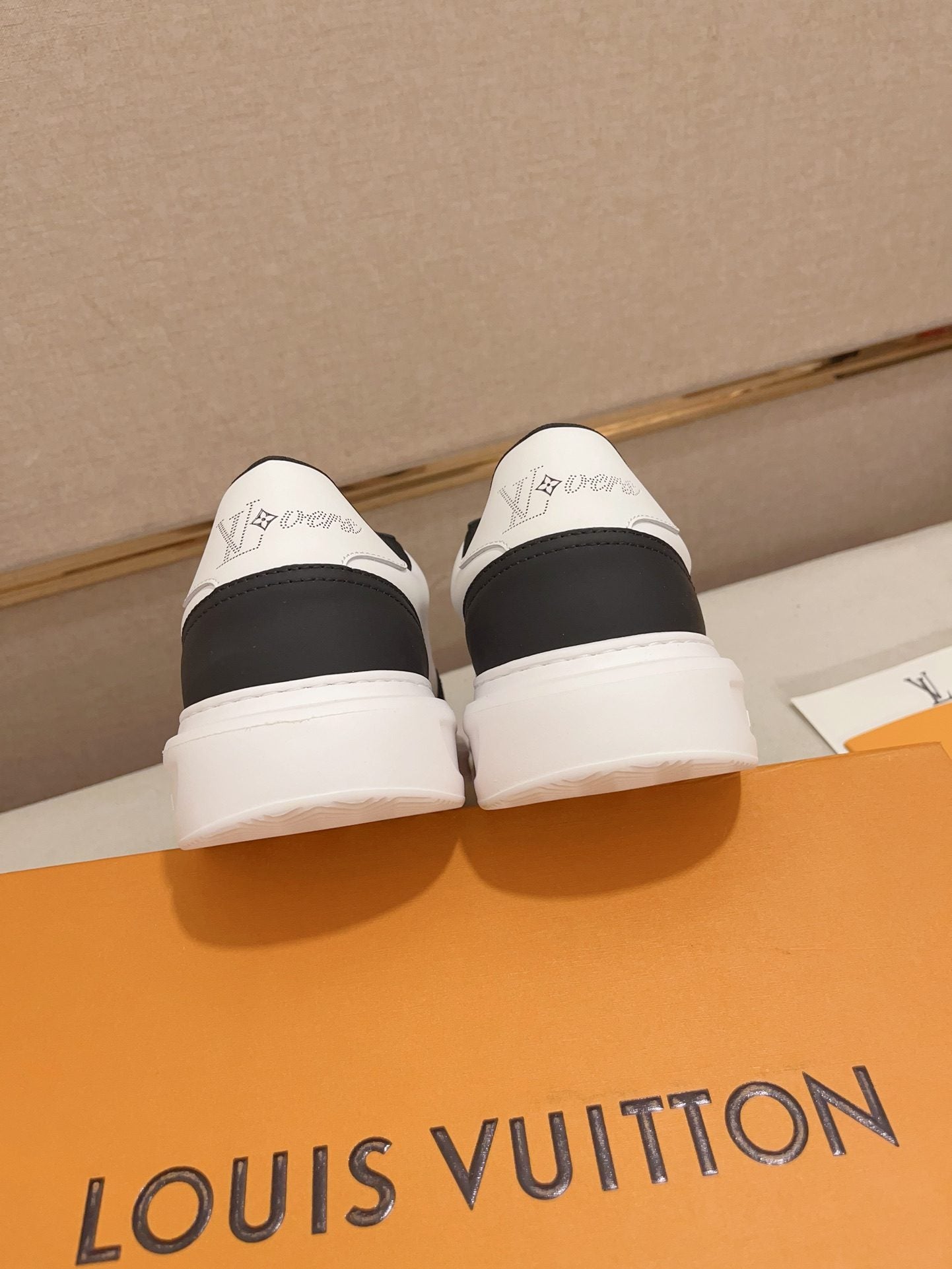 Louis Vuitton black and white contrast low-top sneakers rear heel view