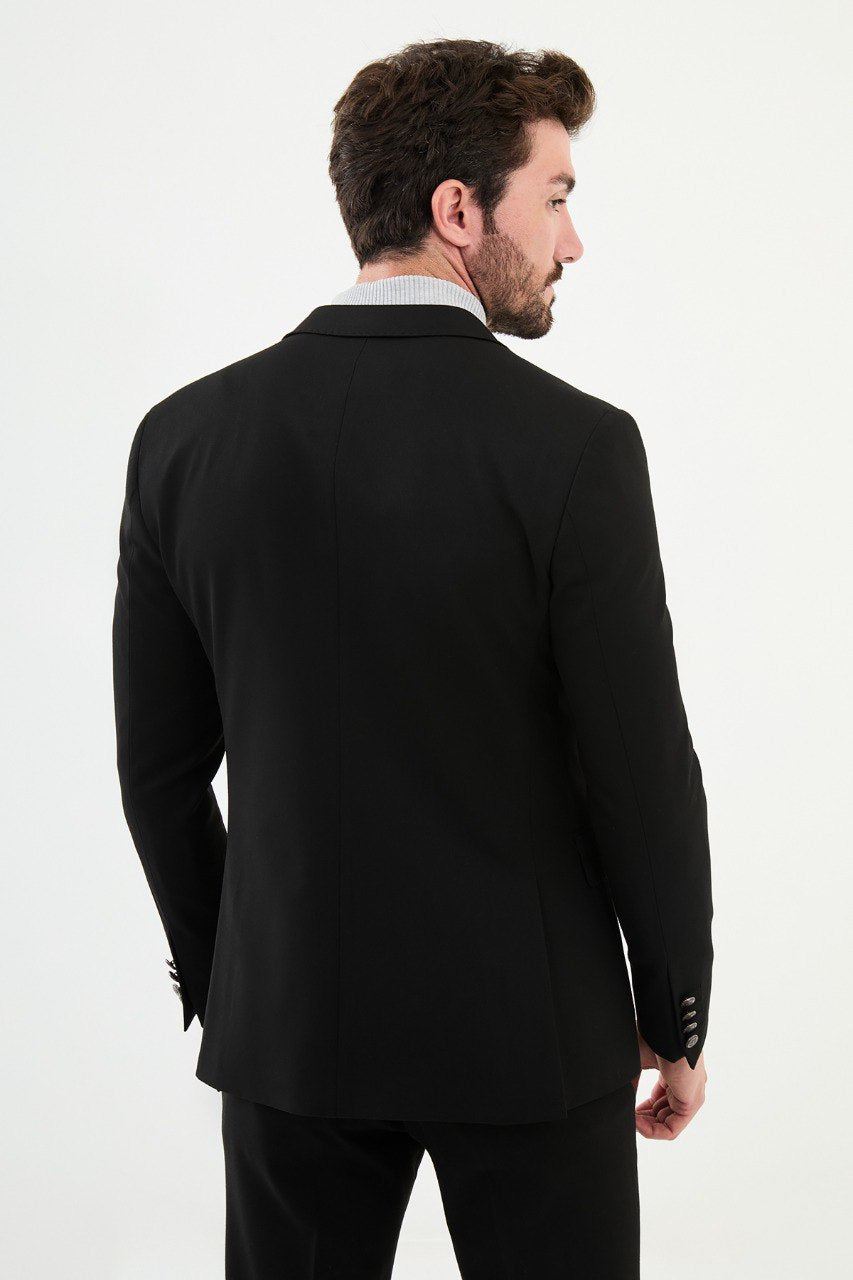 Man wearing a black blazer with a light gray turtleneck, perfect for a sharp, modern, business-casual look.