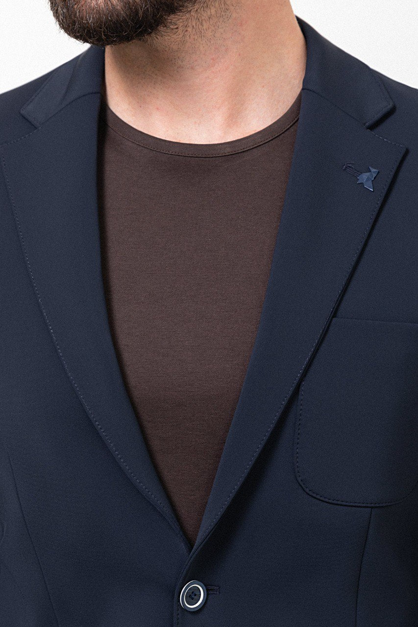 Man wearing a navy blue leisure suit.