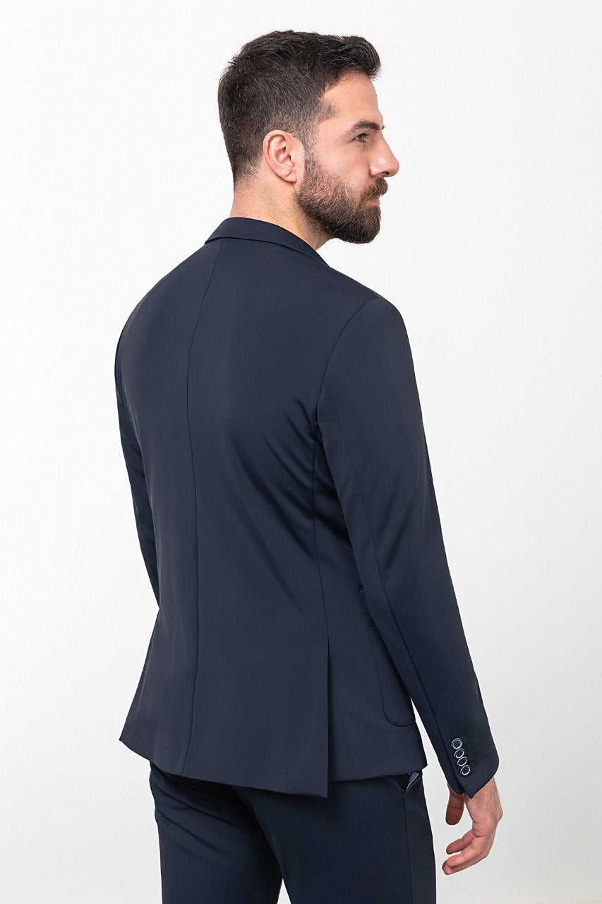 Man wearing a navy blue leisure suit.