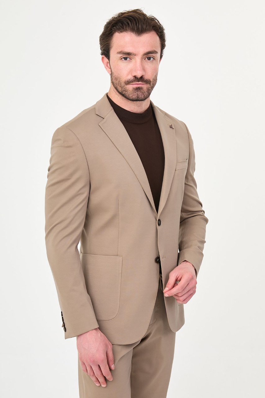 Men's beige two-piece suit side styled view