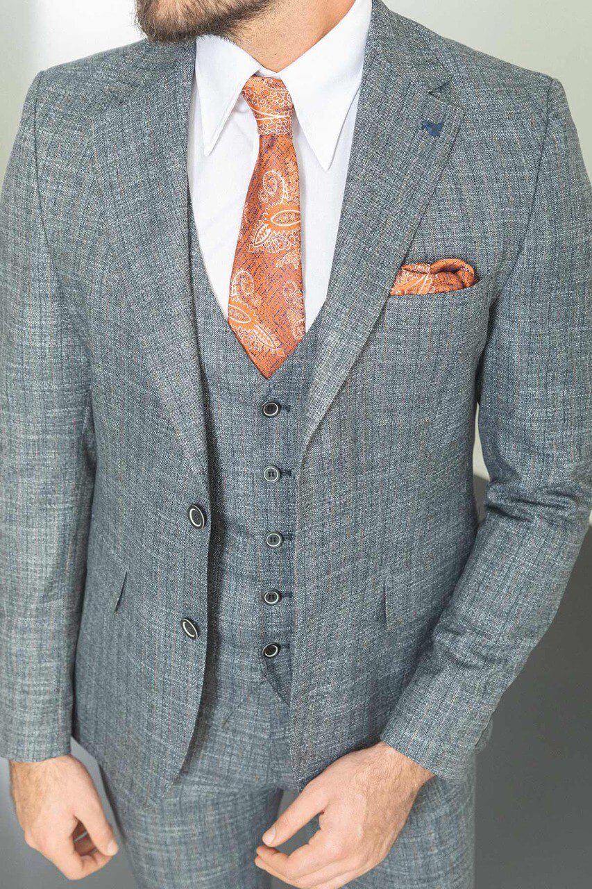 Man wearing a stylish Navy Blue Slim Fit Suit, perfect for weddings and formal occasions.