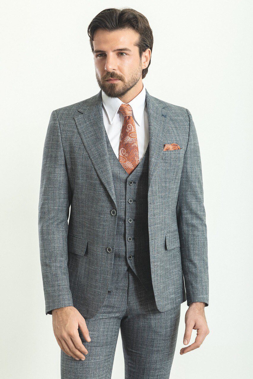 Man wearing a stylish Navy Blue Slim Fit Suit, perfect for weddings and formal occasions.