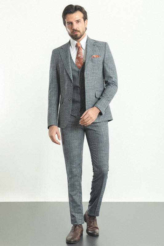 Man wearing a stylish Navy Blue Slim Fit Suit, perfect for weddings and formal occasions.
