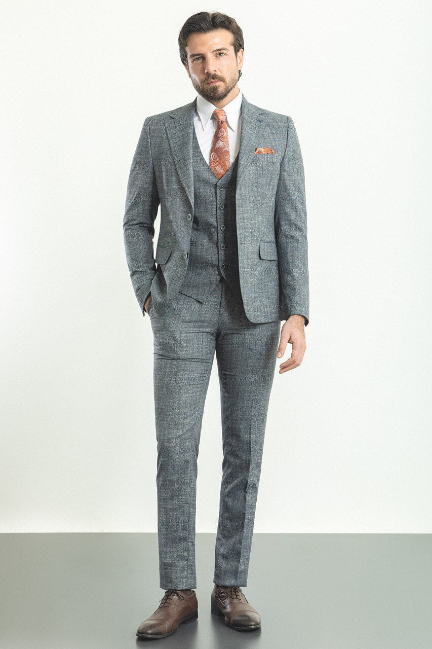 Man wearing a stylish Navy Blue Slim Fit Suit, perfect for weddings and formal occasions.