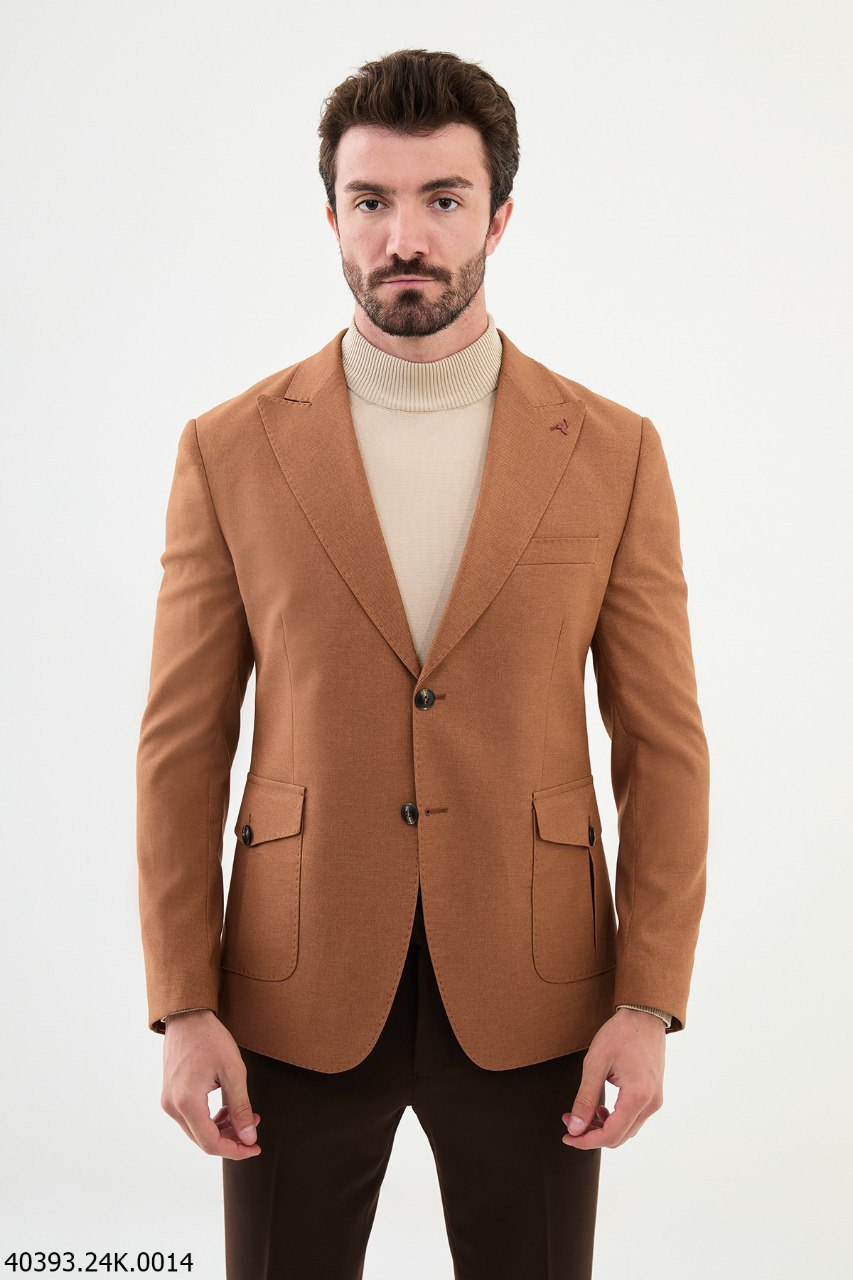 A man wearing a brown modern fit blazer with a V-neck and button-up front, paired with brown trousers.