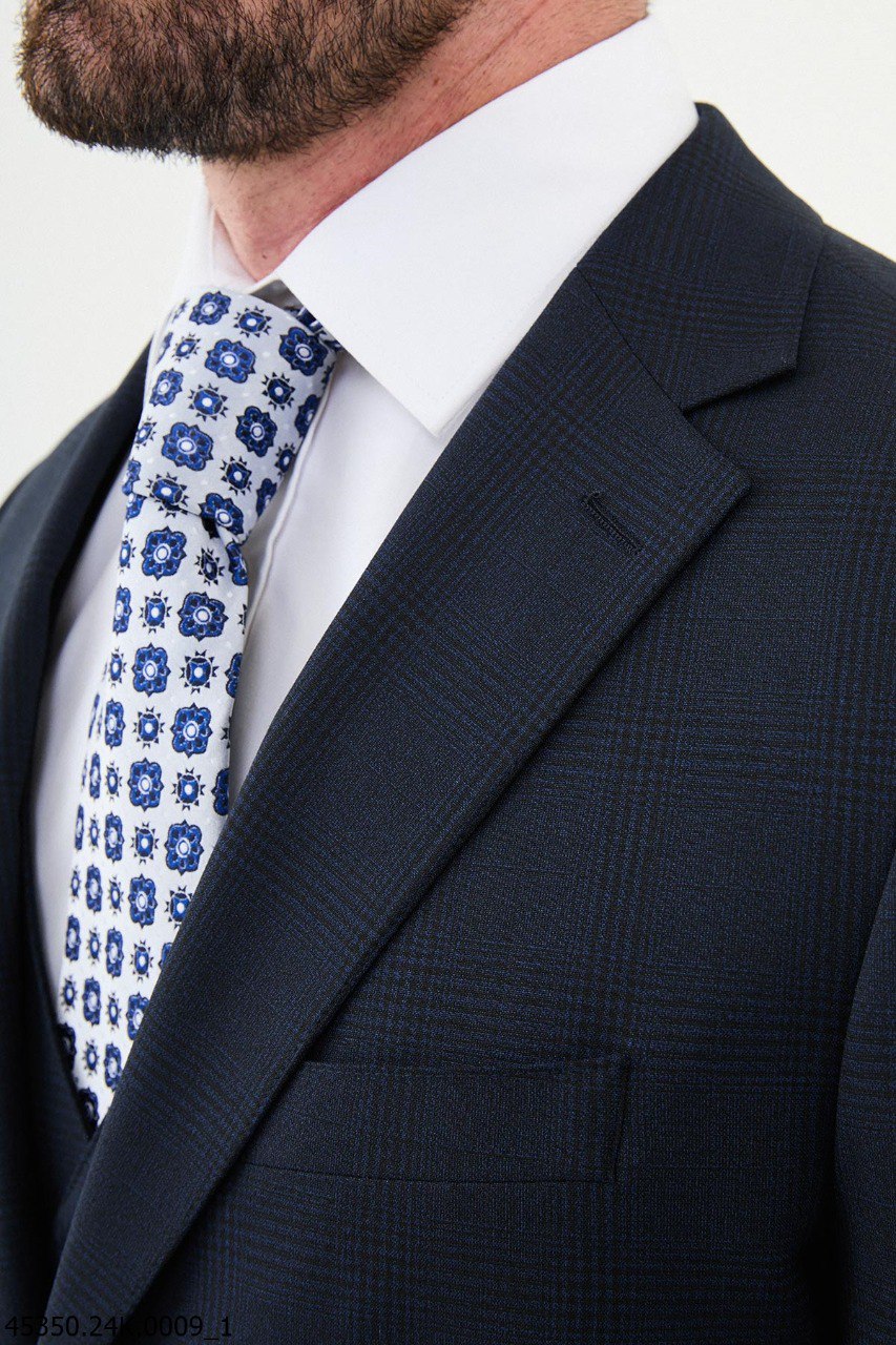 Navy Blue Checkered Three-Piece Suit with Geometric Tie