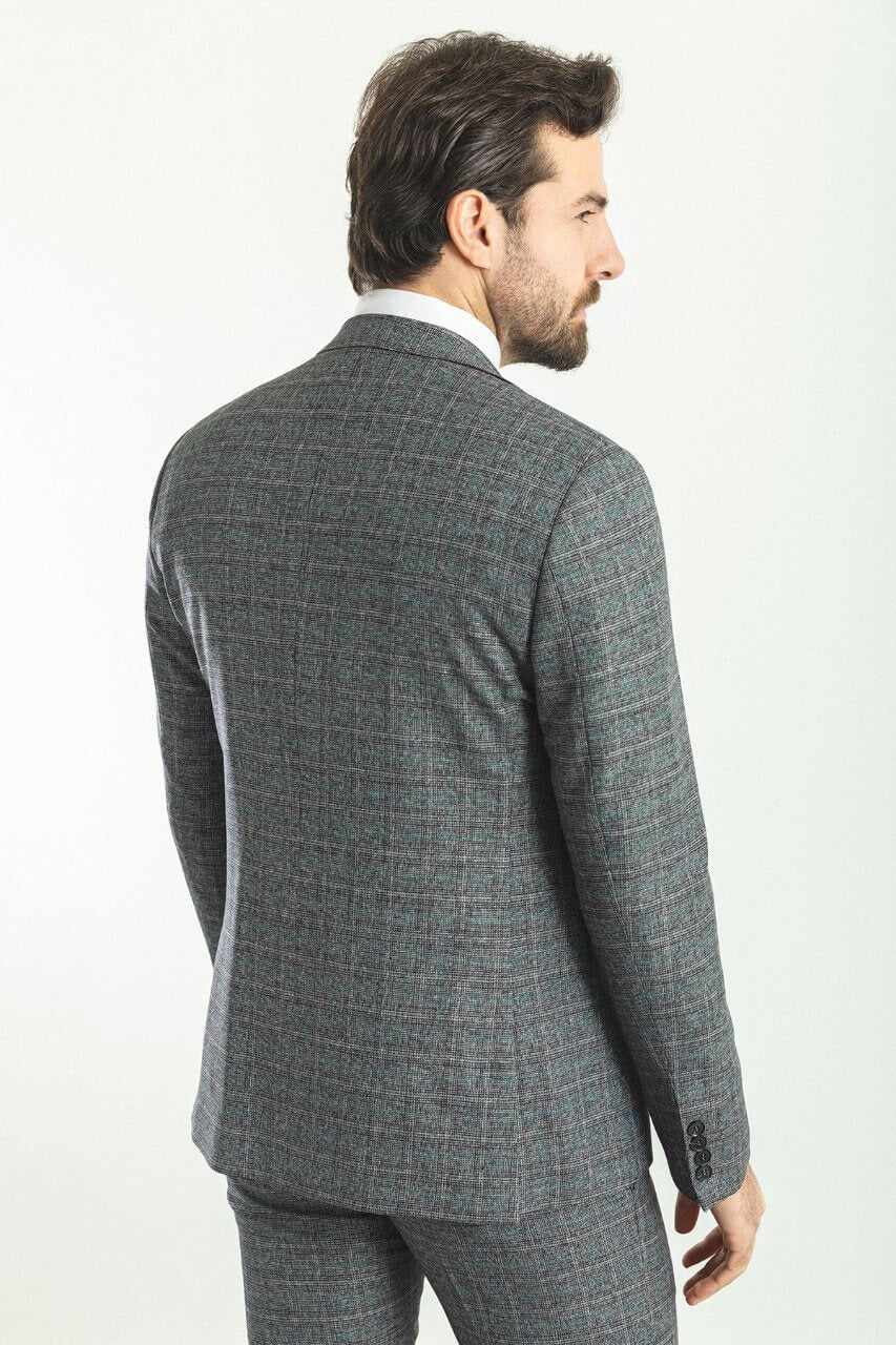 Man wearing a plaid dark gray 3-piece suit with a patterned tie, showcasing sophisticated menswear from Suitharbor.