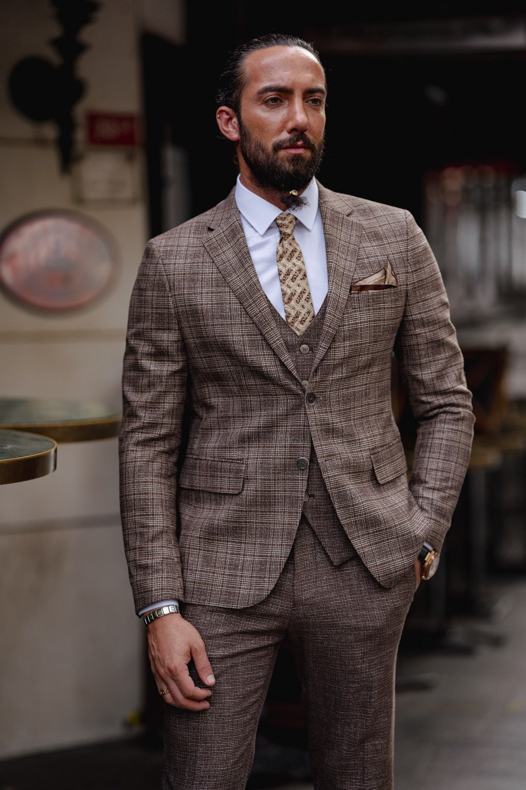 A Brown Slim Fit Plaid Detailed Suit on display.