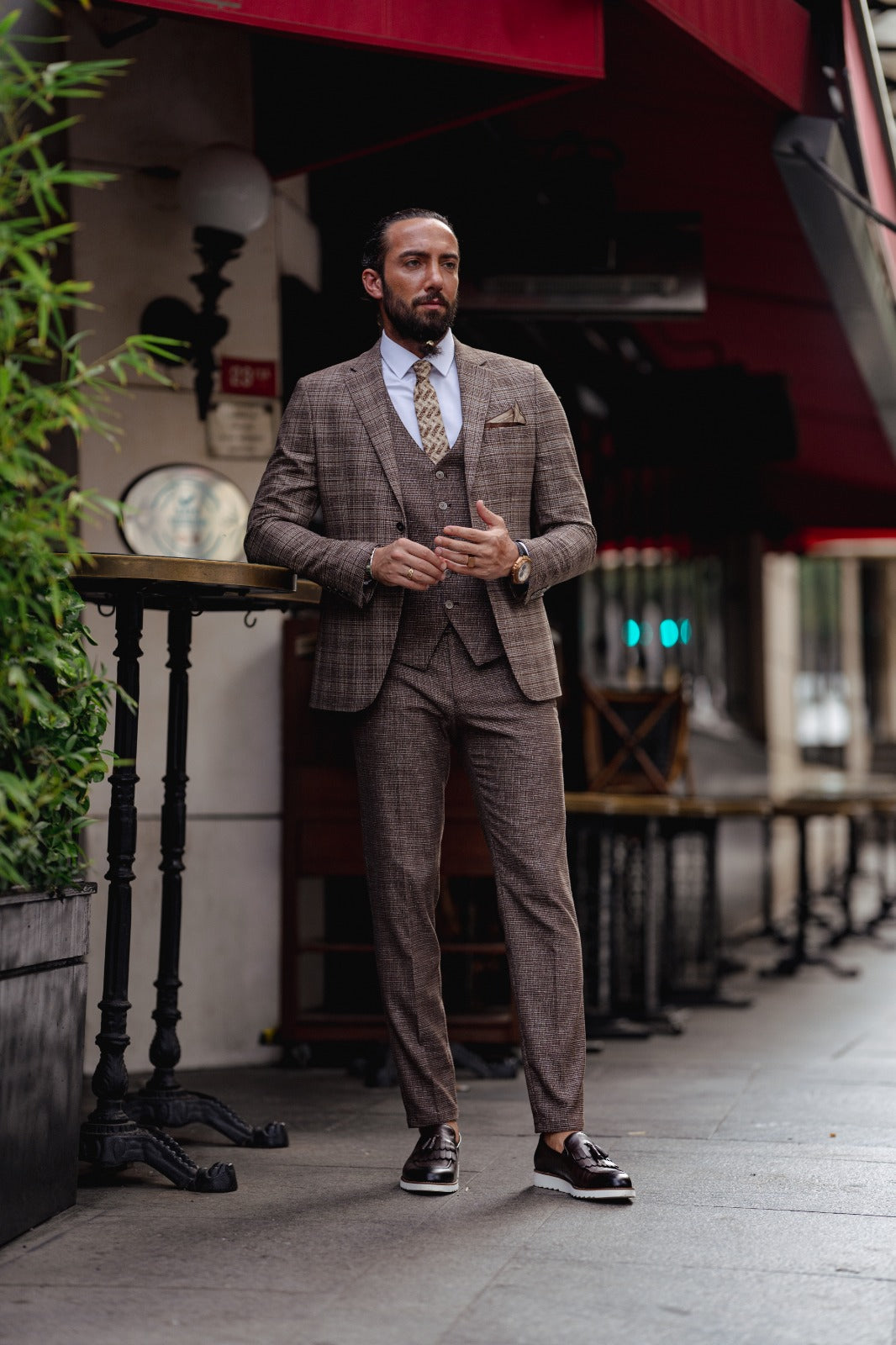 A Brown Slim Fit Plaid Detailed Suit on display.