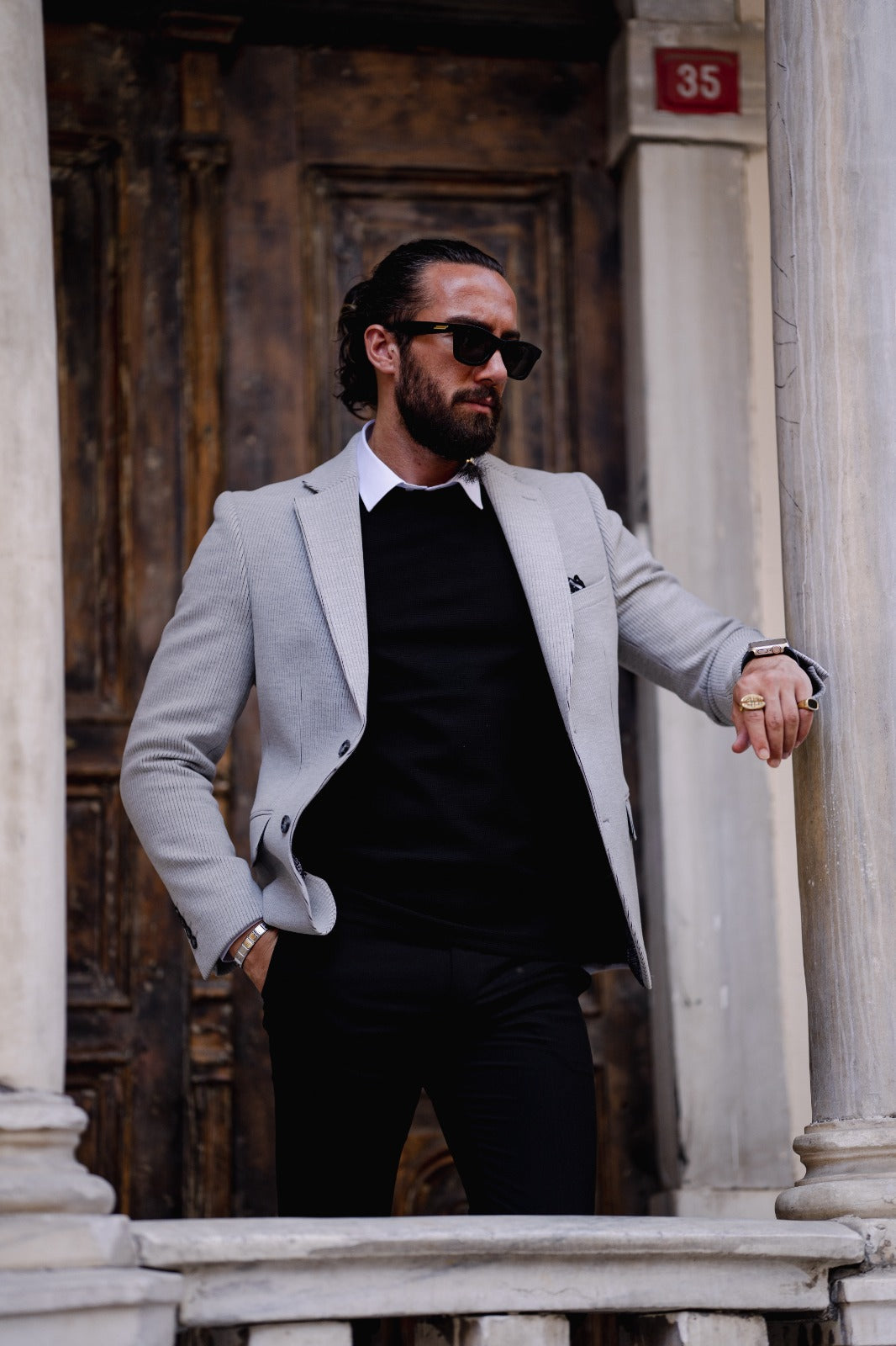 A Grey Slim Fit jacket on display.