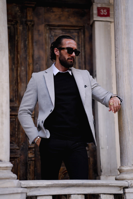 A Grey Slim Fit jacket on display.