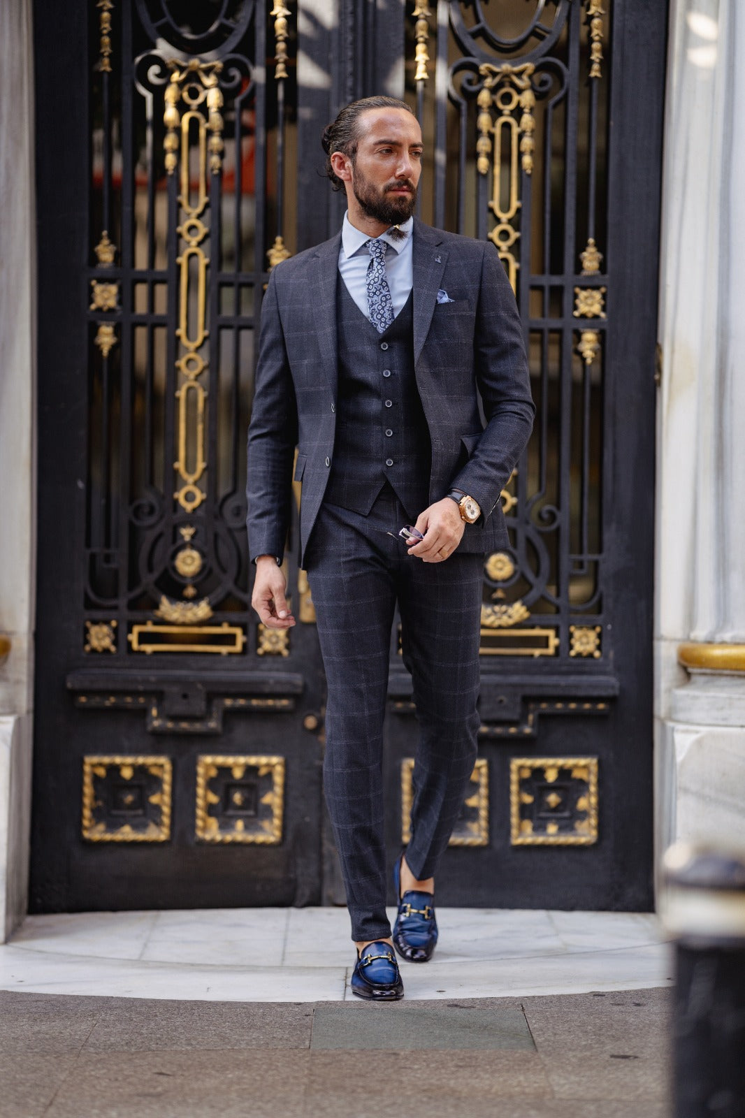 A Navy blue Slim Fit Plaid Detailed Suit on display.