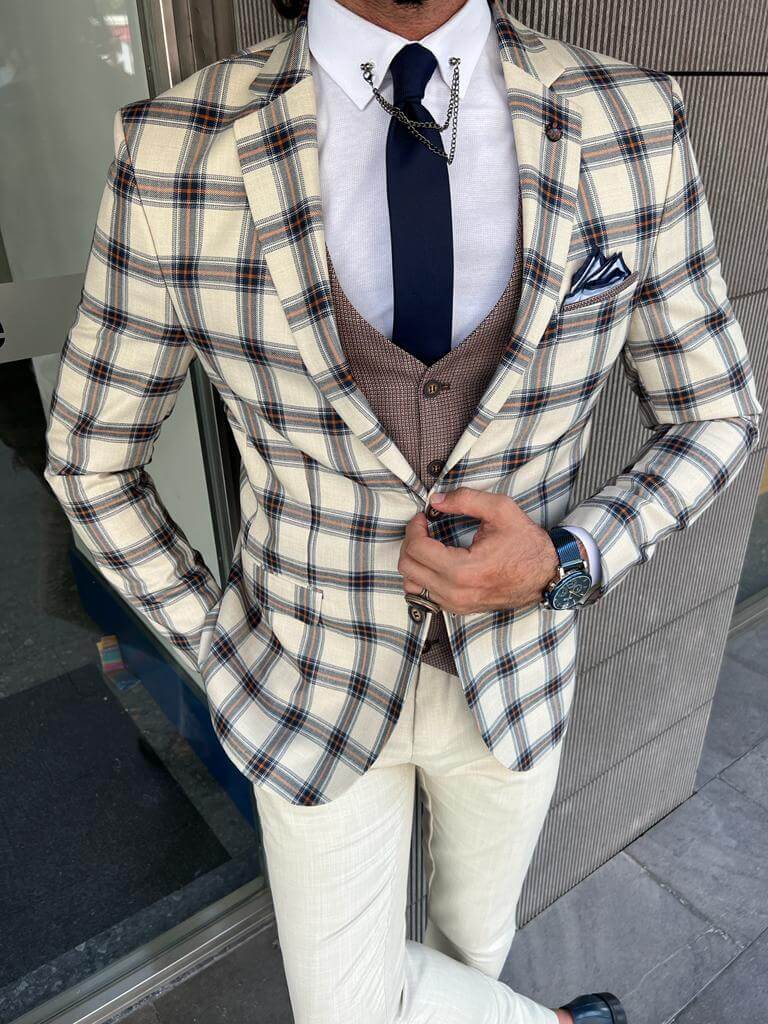 Men's patterned beige wedding suit with a modern twist.