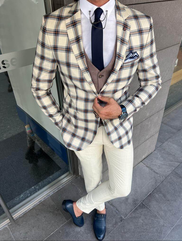 Men's patterned beige wedding suit with a modern twist.