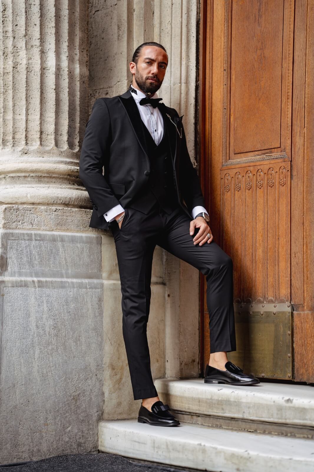 A Velvet Collar Tuxedo Black Suit on display.