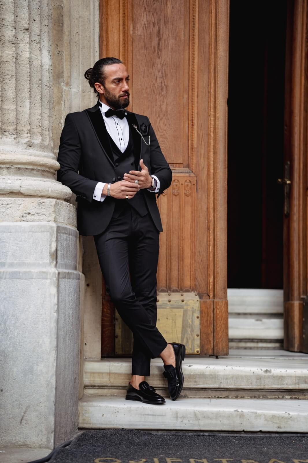 A Velvet Collar Tuxedo Black Suit on display.