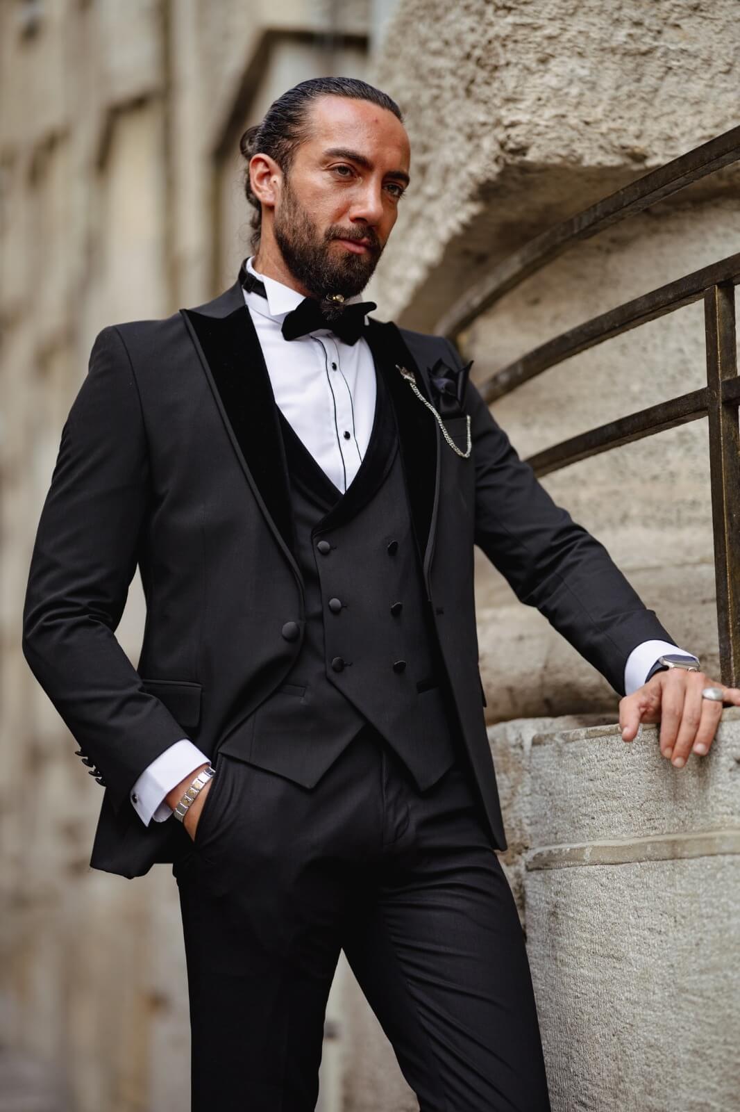 A Velvet Collar Tuxedo Black Suit on display.