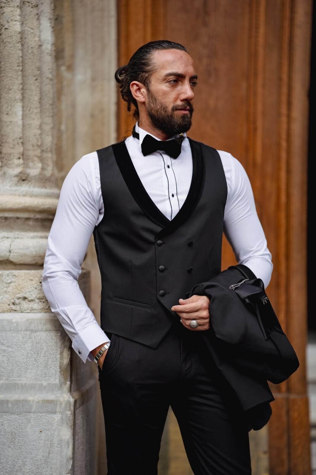 A Velvet Collar Tuxedo Black Suit on display.