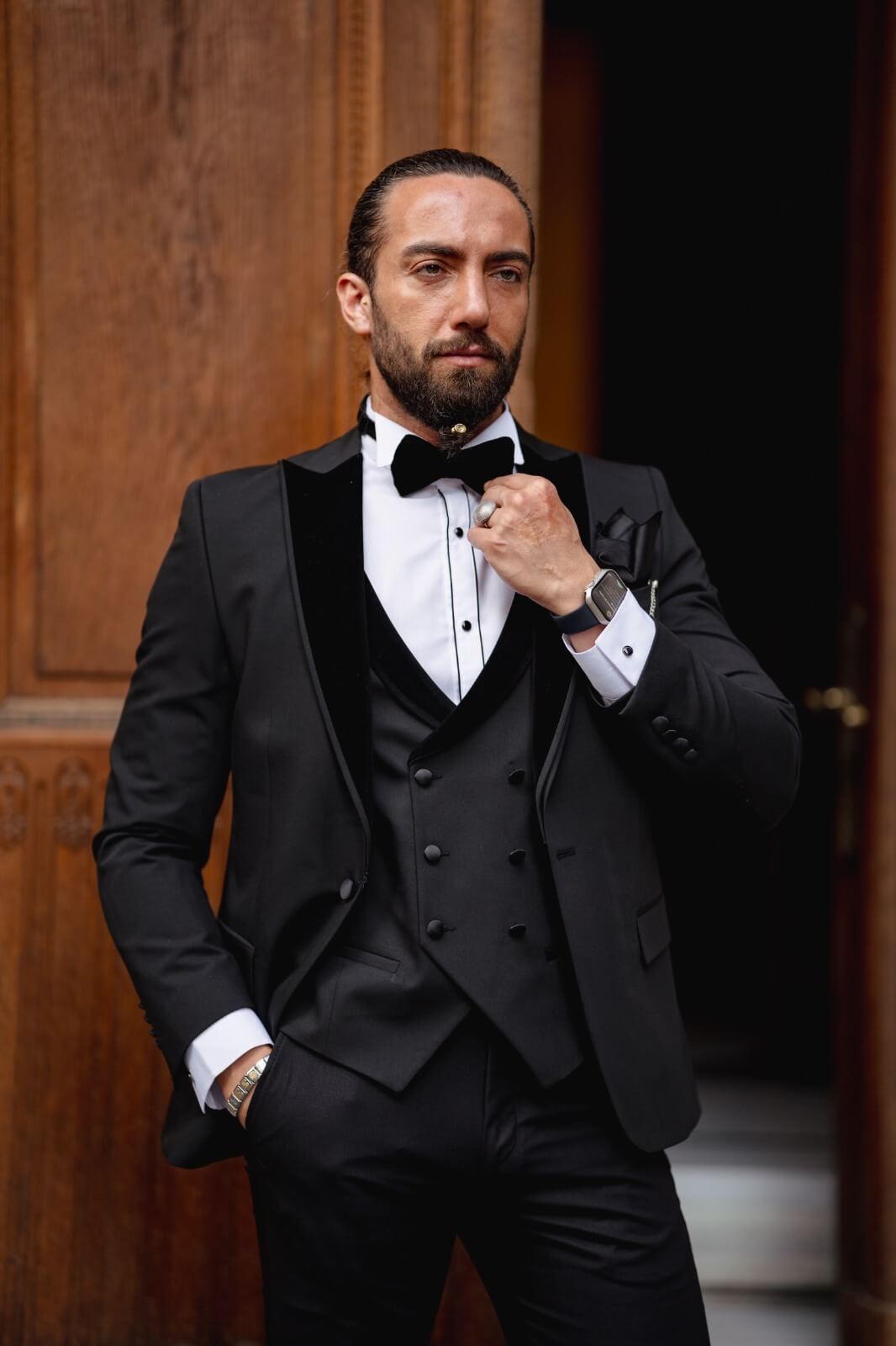 A Velvet Collar Tuxedo Black Suit on display.