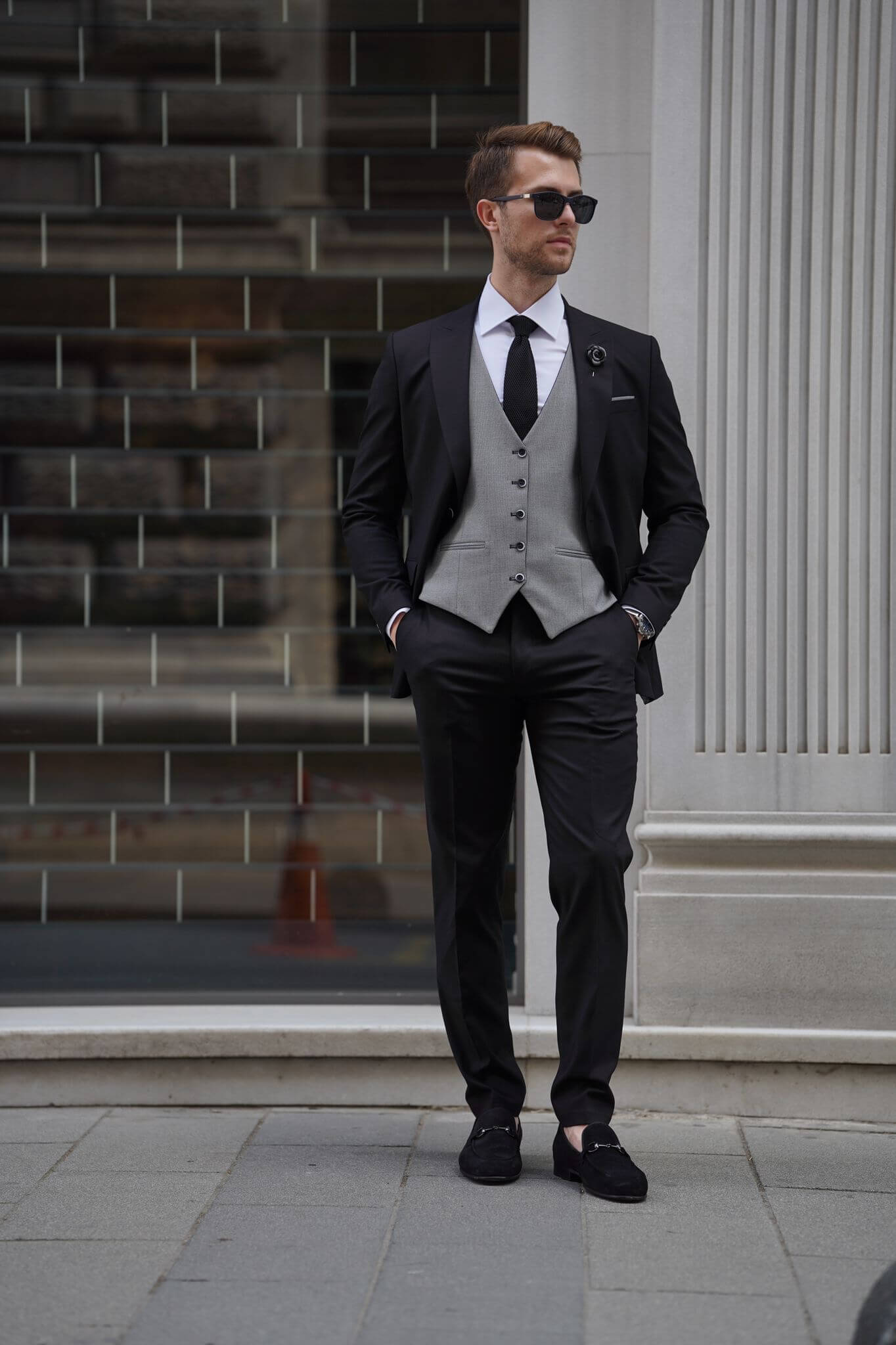 A Slim Fit Wool Black and Gray Suit on display.