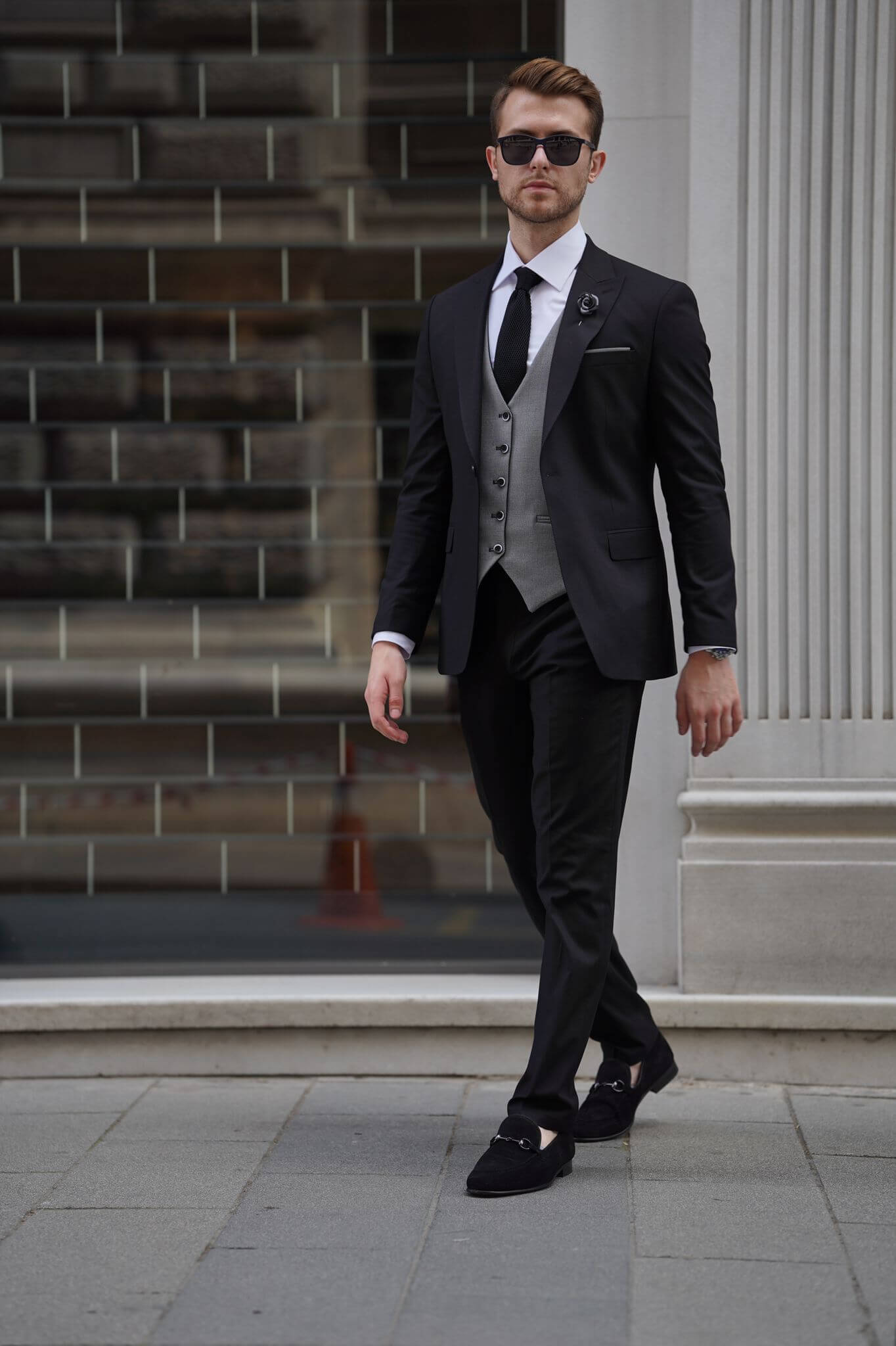 A Slim Fit Wool Black and Gray Suit on display.