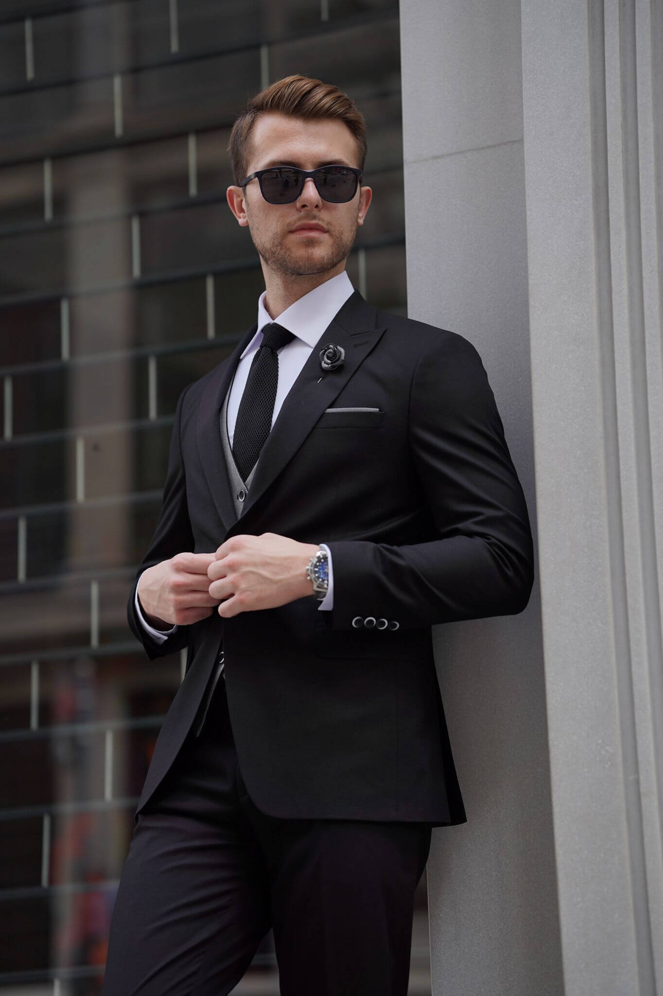 A Slim Fit Wool Black and Gray Suit on display.
