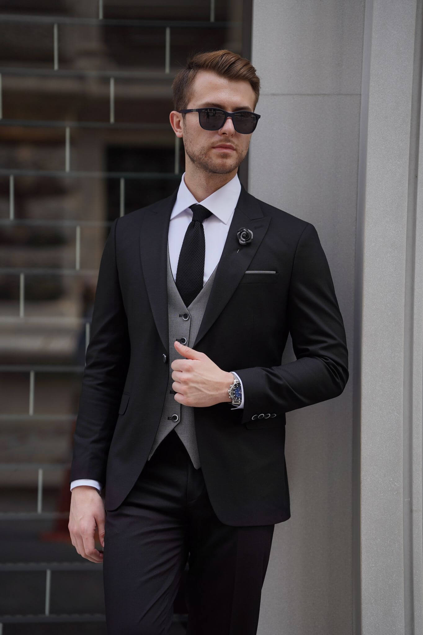 A Slim Fit Wool Black and Gray Suit on display.