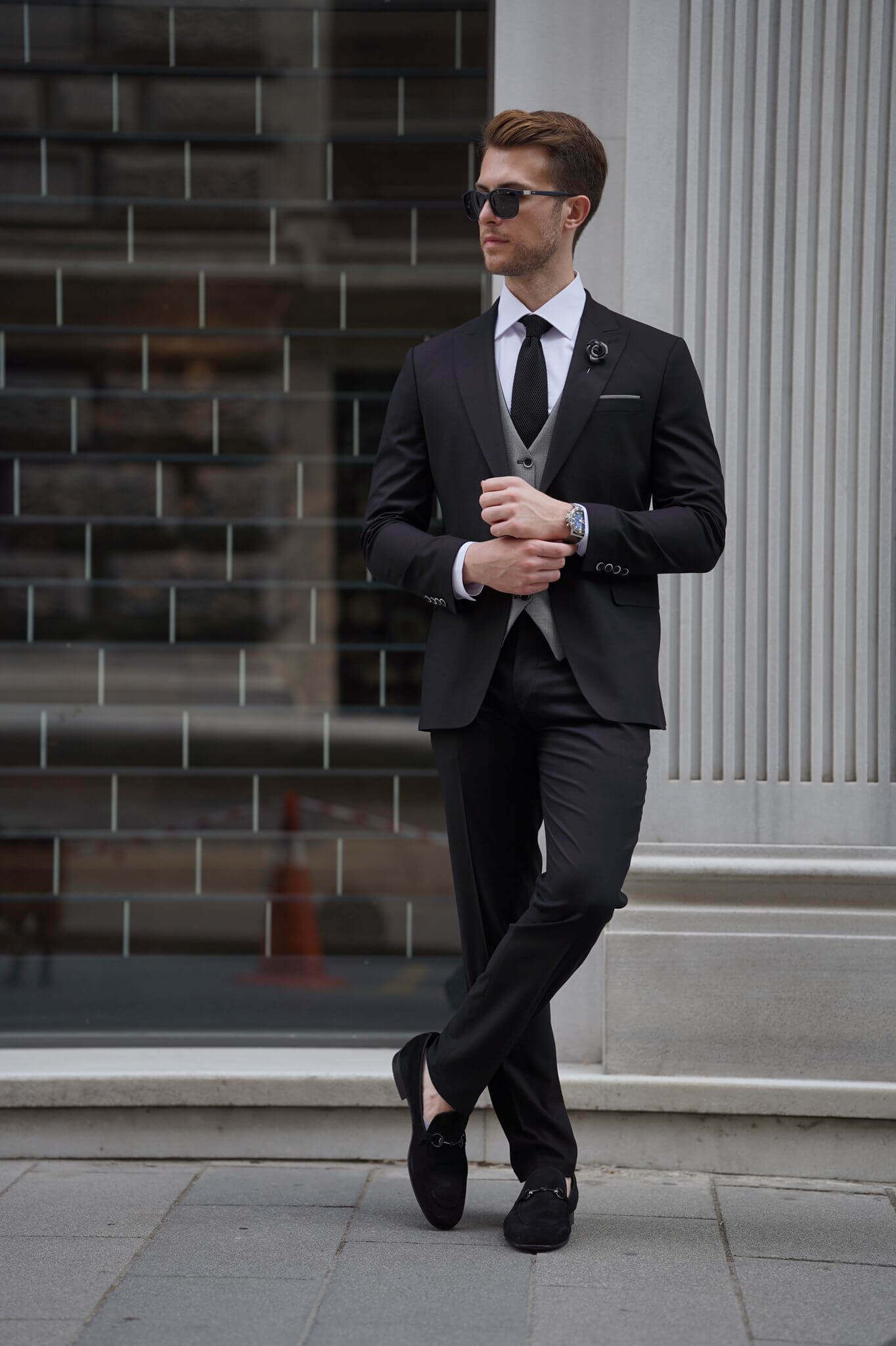 A Slim Fit Wool Black and Gray Suit on display.