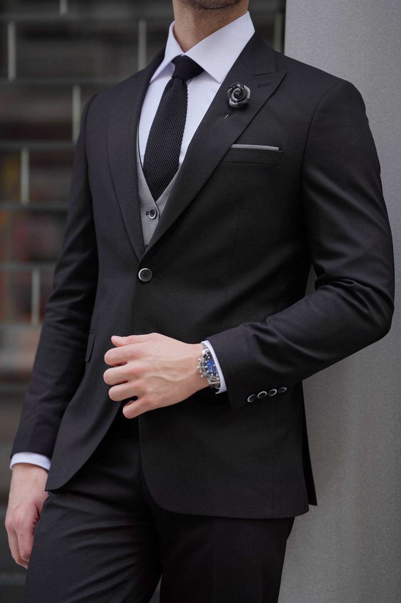A Slim Fit Wool Black and Gray Suit on display.