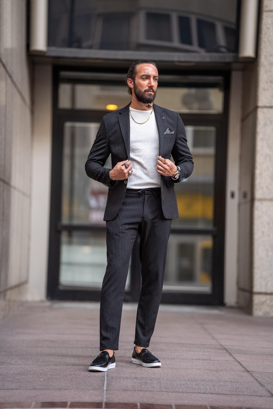 Black men's suit with striped plaid pattern.