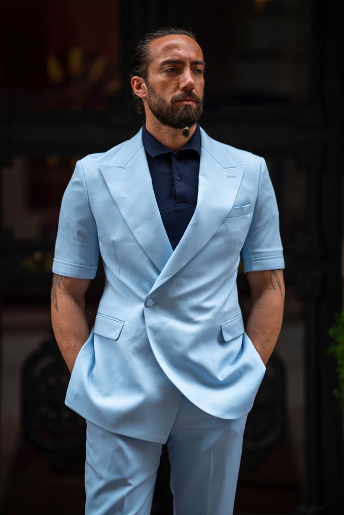A Blue Short Sleeve Suit on display